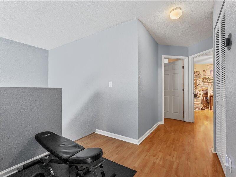 20970 Via Alamanda Boca Raton, FL 33428 - Photo 21 of 51 a view of a workspace with furniture and wooden floor
