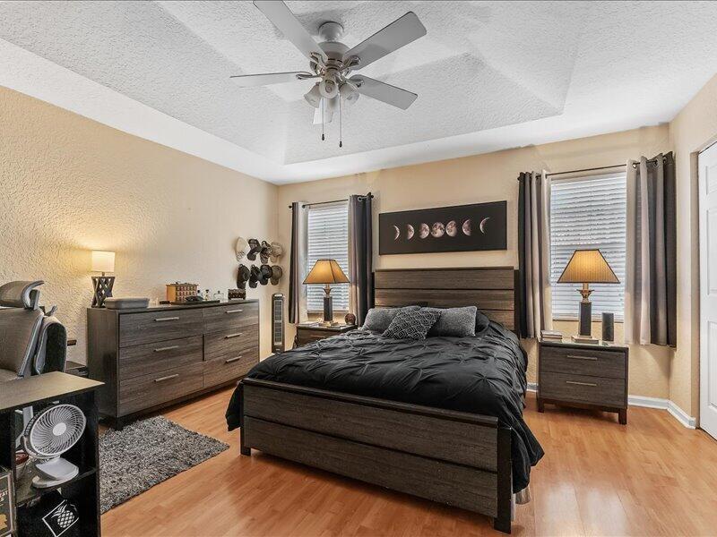 20970 Via Alamanda Boca Raton, FL 33428 - Photo 22 of 51 a bedroom with a bed and ceiling fan