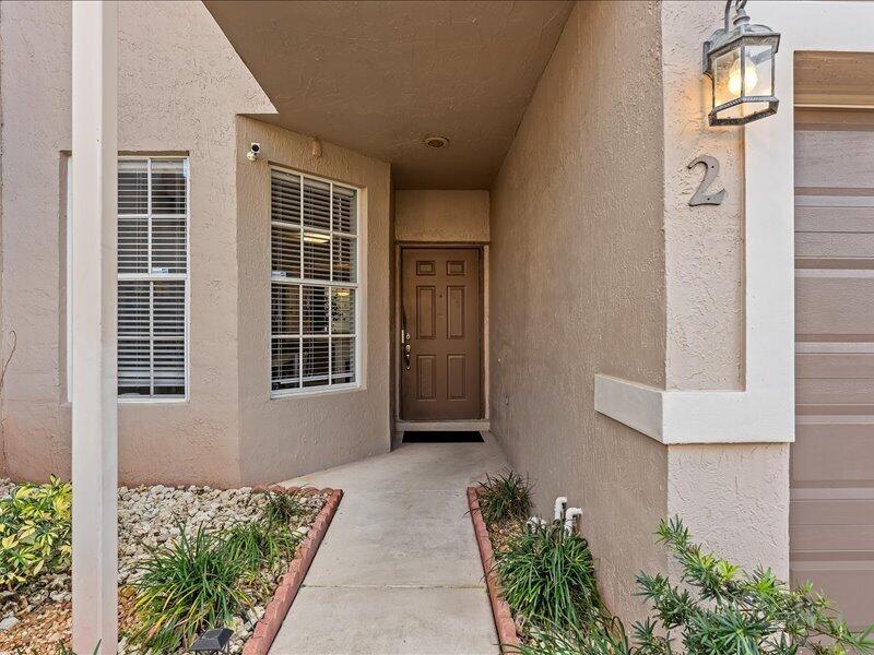 20970 Via Alamanda Boca Raton, FL 33428 - Photo 3 of 51 front view of a house