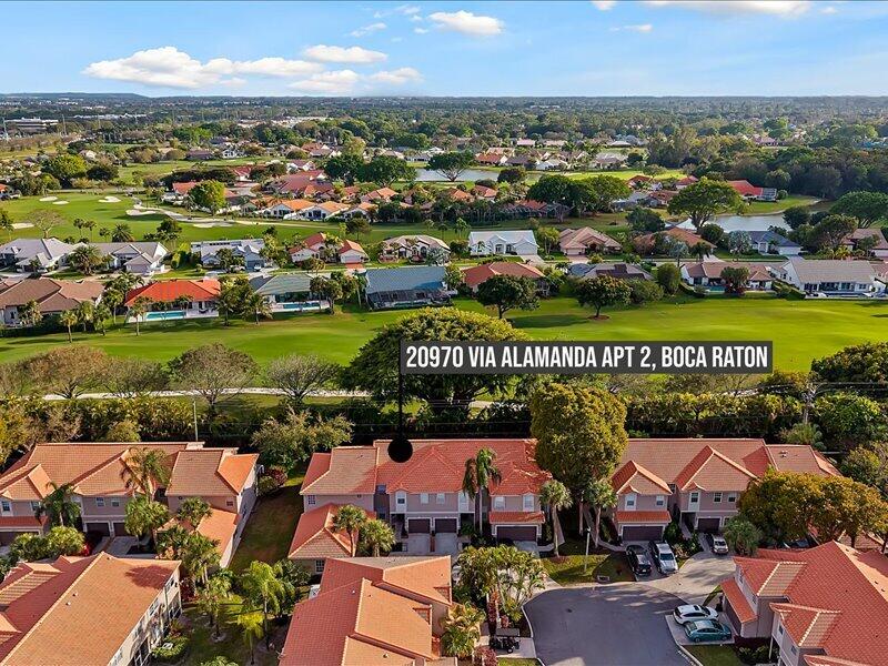 20970 Via Alamanda Boca Raton, FL 33428 - Photo 35 of 51 an aerial view of residential building and lake
