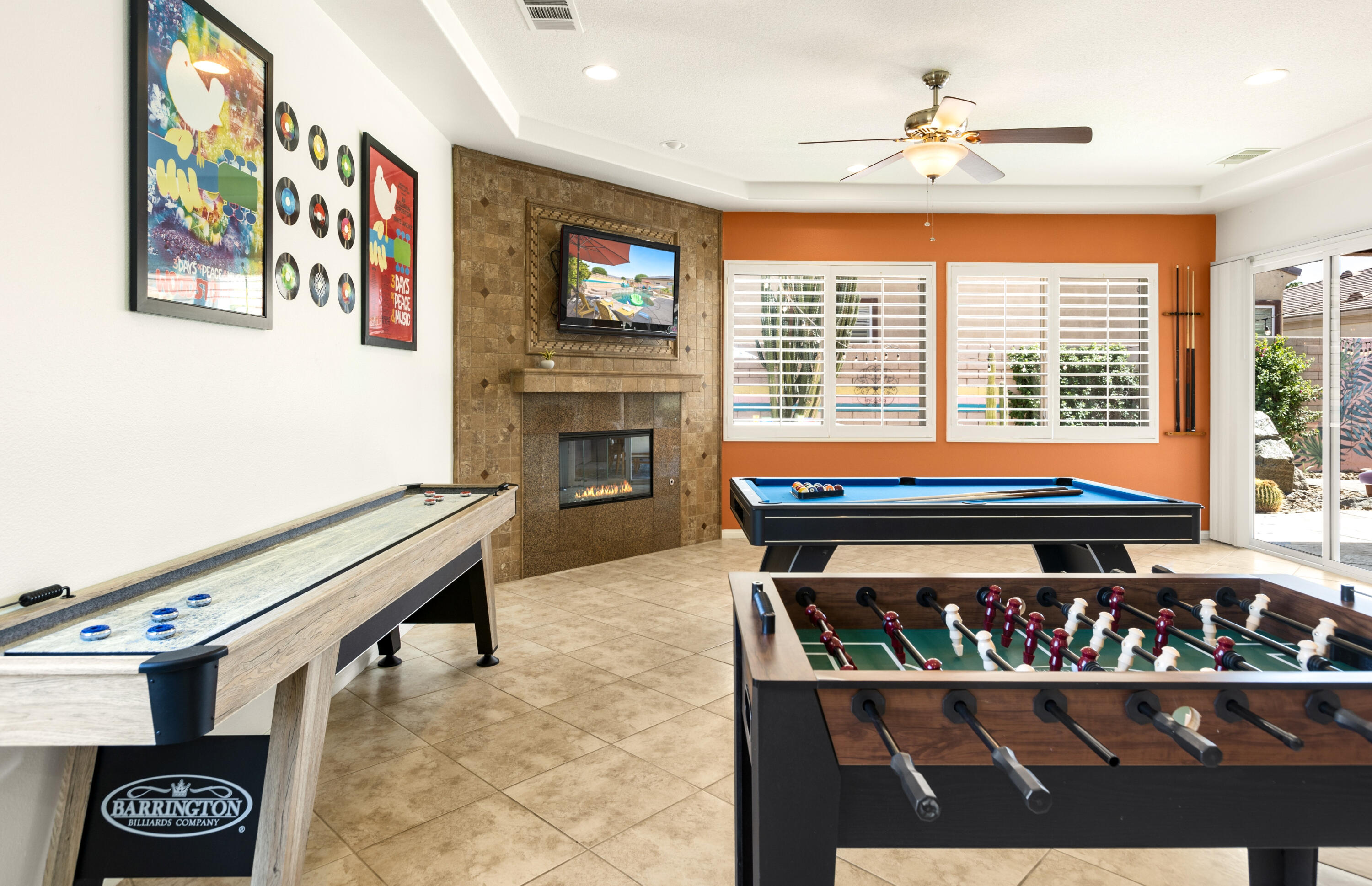 43760 Spiaggia Place Indio, CA 92203 - Photo 13 of 38 a living room with furniture a fireplace and a flat screen tv