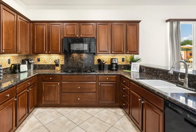 a kitchen with a sink and a stove