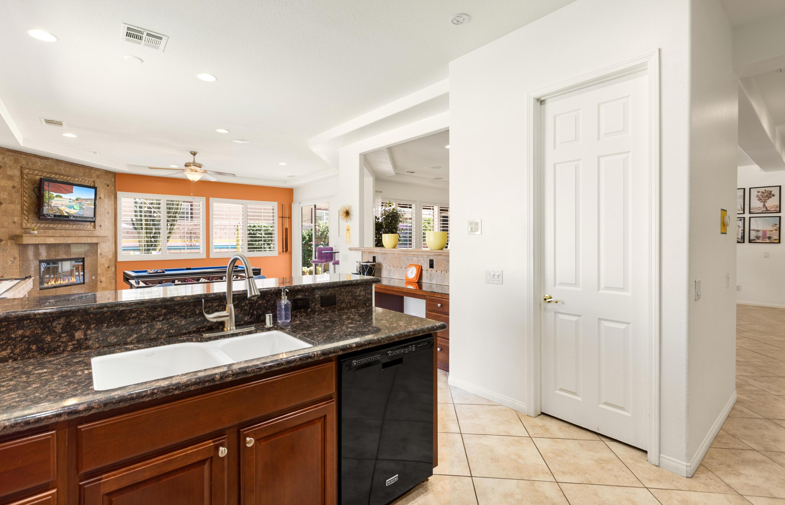 43760 Spiaggia Place Indio, CA 92203 - Photo 17 of 38 a kitchen with granite countertop a sink and a counter top space