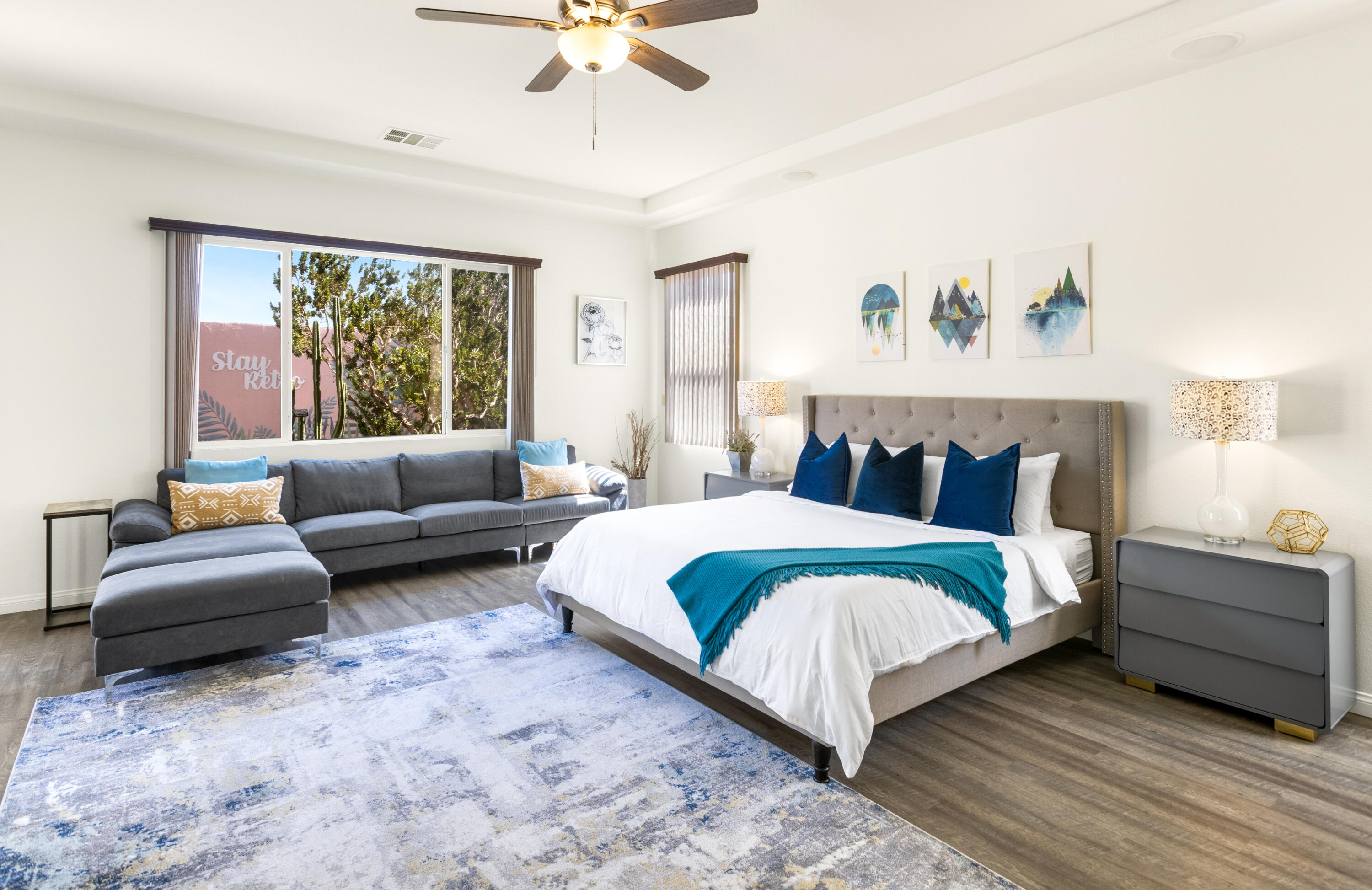 43760 Spiaggia Place Indio, CA 92203 - Photo 18 of 38 a spacious bedroom with a bed and a couch