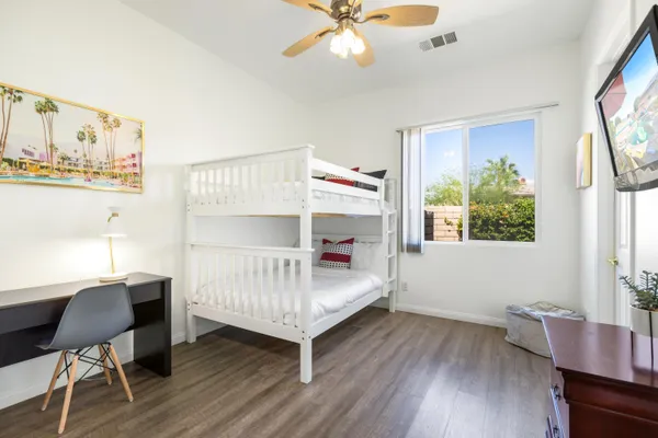 a bedroom with furniture and a window