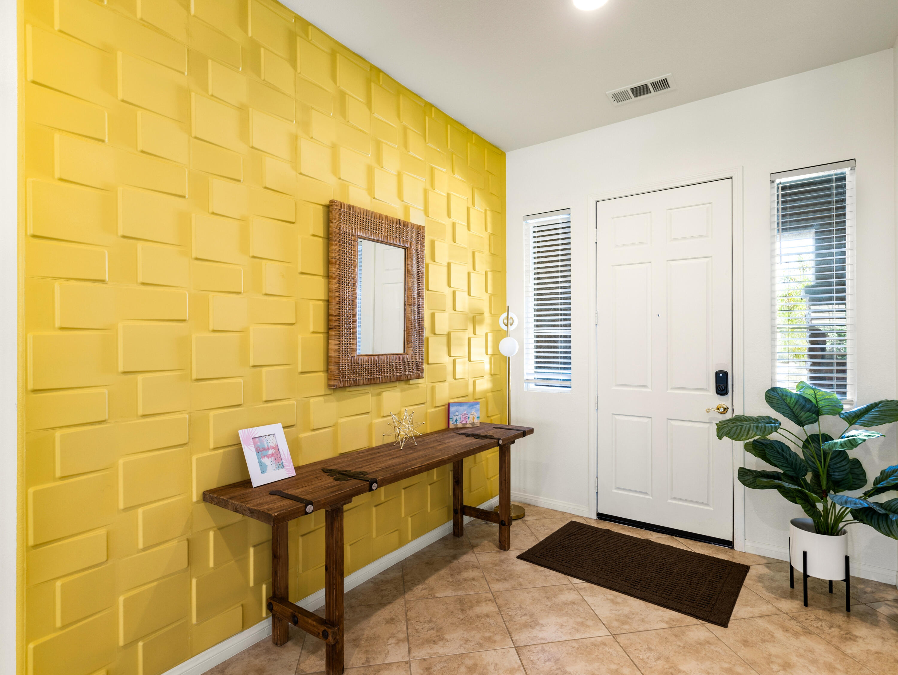 43760 Spiaggia Place Indio, CA 92203 - Photo 3 of 38 a living room with furniture and a potted plant