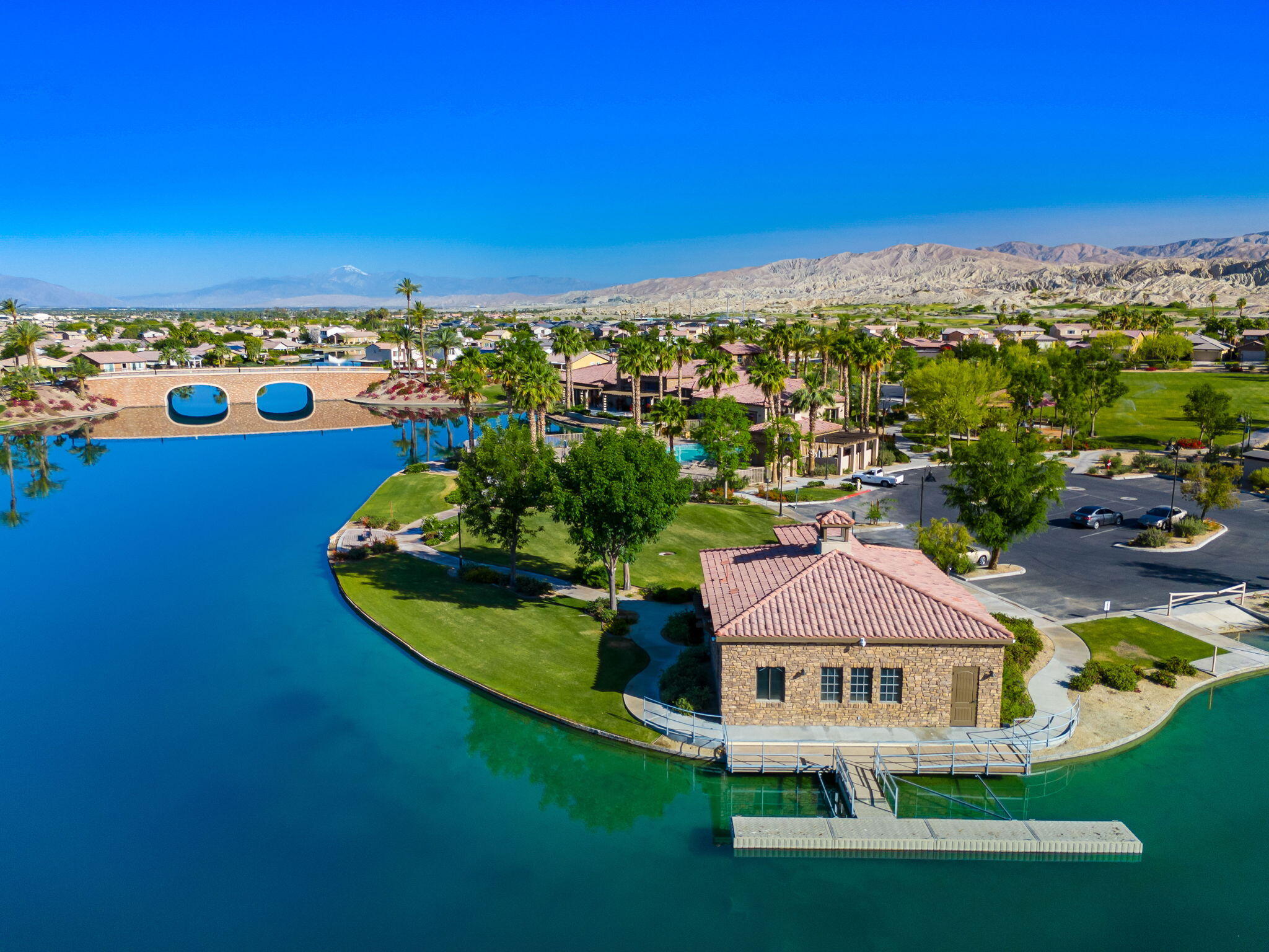 43760 Spiaggia Place Indio, CA 92203 - Photo 36 of 38 a view of a lake with a house in the background