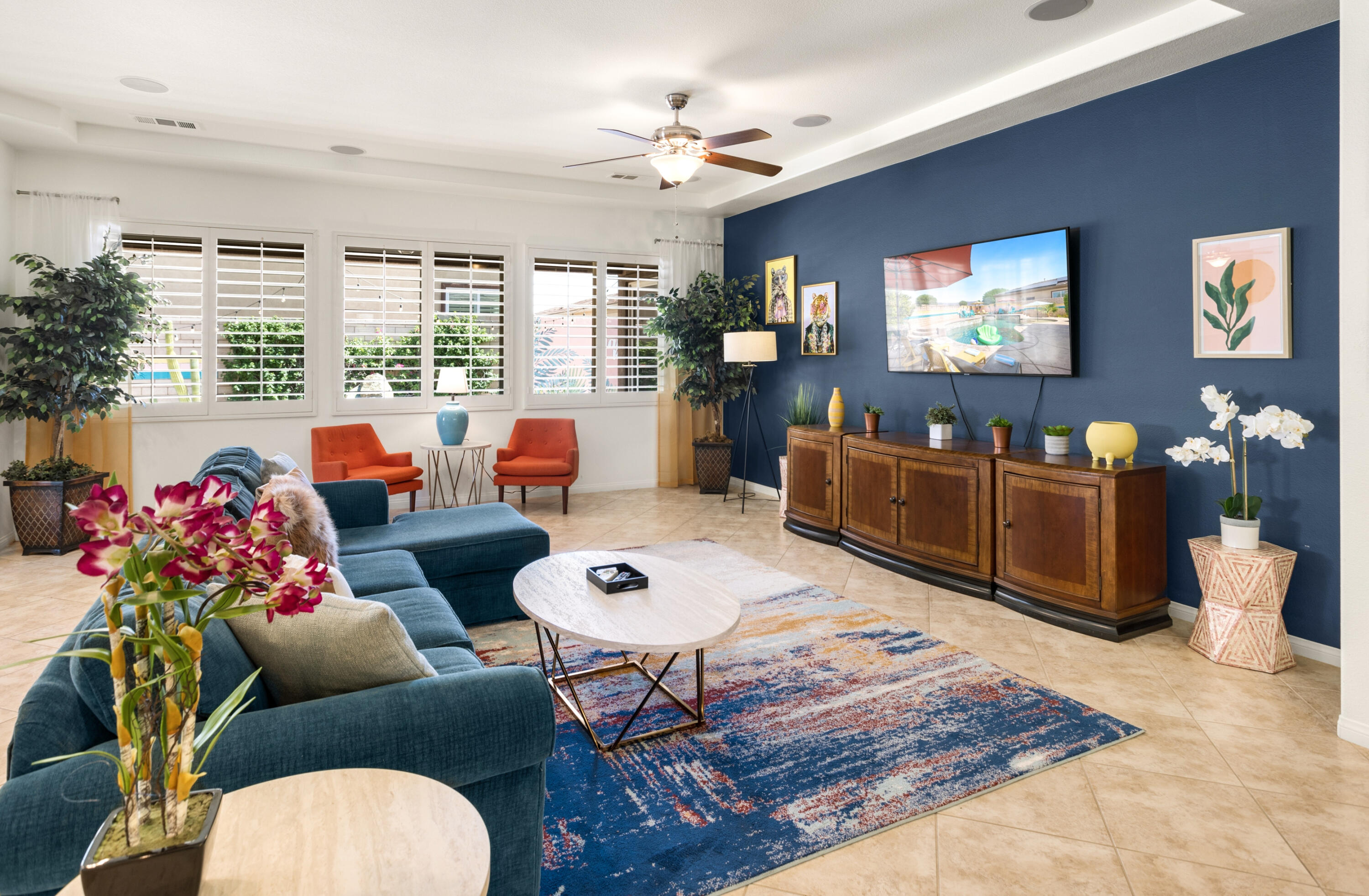 43760 Spiaggia Place Indio, CA 92203 - Photo 5 of 38 a living room with furniture a chandelier and a dining table