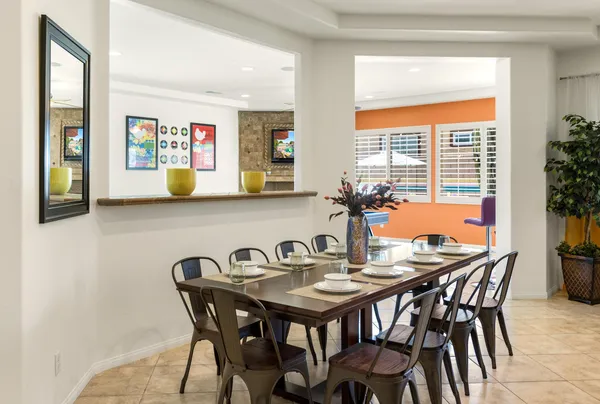 a view of a dining room with furniture and window