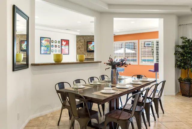 a view of a dining room with furniture and window