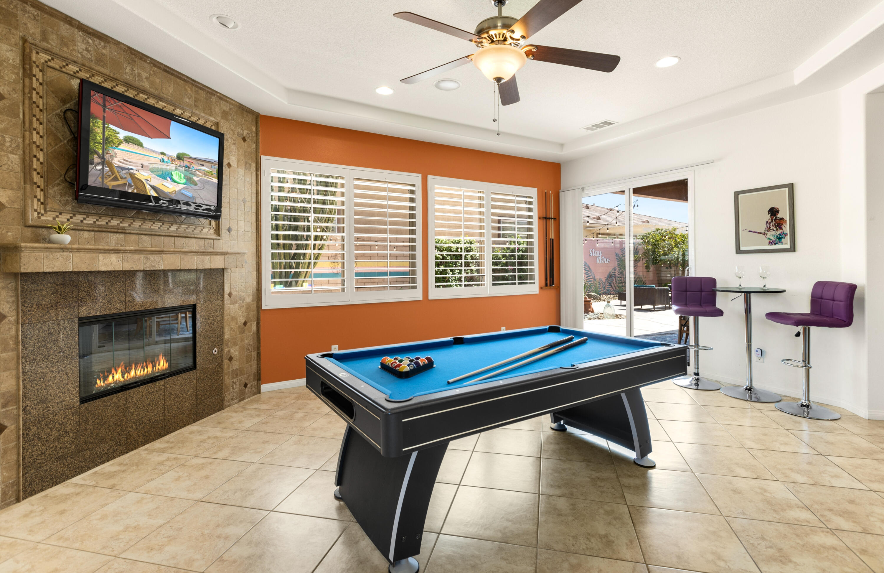 43760 Spiaggia Place Indio, CA 92203 - Photo 10 of 38 a room with furniture pool table flat screen tv and windows