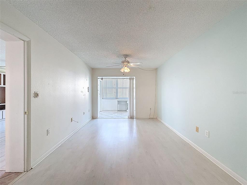 4550 Cove Circle, Unit 507 St. Petersburg, FL 33708 - Photo 15 of 32 an empty room with closet and windows