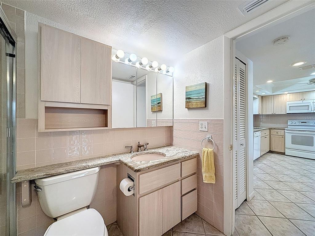 4550 Cove Circle, Unit 507 St. Petersburg, FL 33708 - Photo 16 of 32 a kitchen with a sink cabinets and appliances