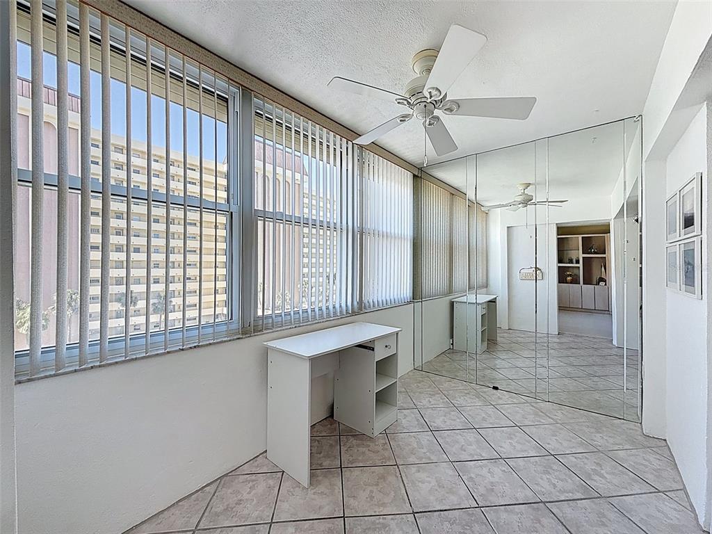 4550 Cove Circle, Unit 507 St. Petersburg, FL 33708 - Photo 18 of 32 a view of an entryway with a chandelier