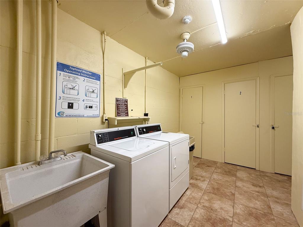4550 Cove Circle, Unit 507 St. Petersburg, FL 33708 - Photo 20 of 32 a room with storage and utility