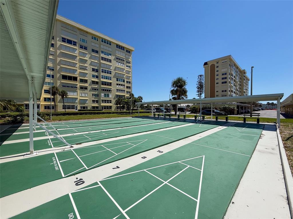 4550 Cove Circle, Unit 507 St. Petersburg, FL 33708 - Photo 28 of 32 a view of a tennis court
