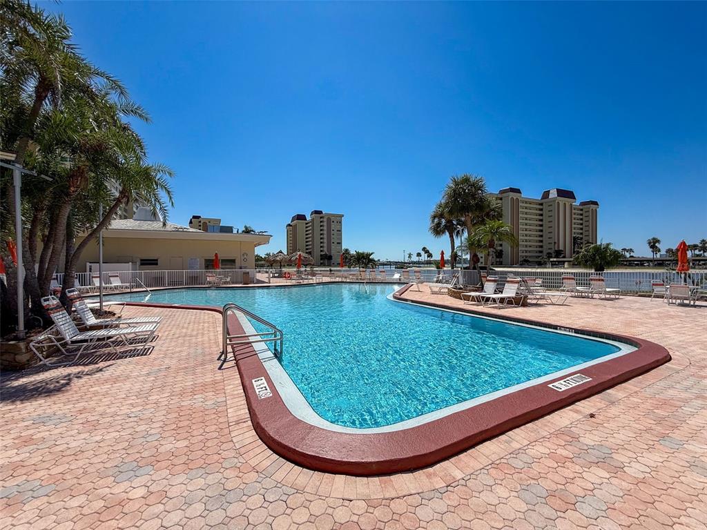 4550 Cove Circle, Unit 507 St. Petersburg, FL 33708 - Photo 29 of 32 a view of a swimming pool with a patio