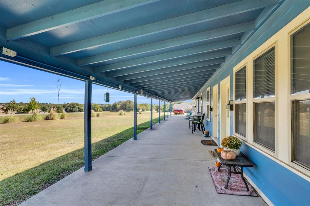 3841 Ledgestone Lane Midlothian, TX 76065 - Photo 12 of 26 a view of a porch with furniture and a patio