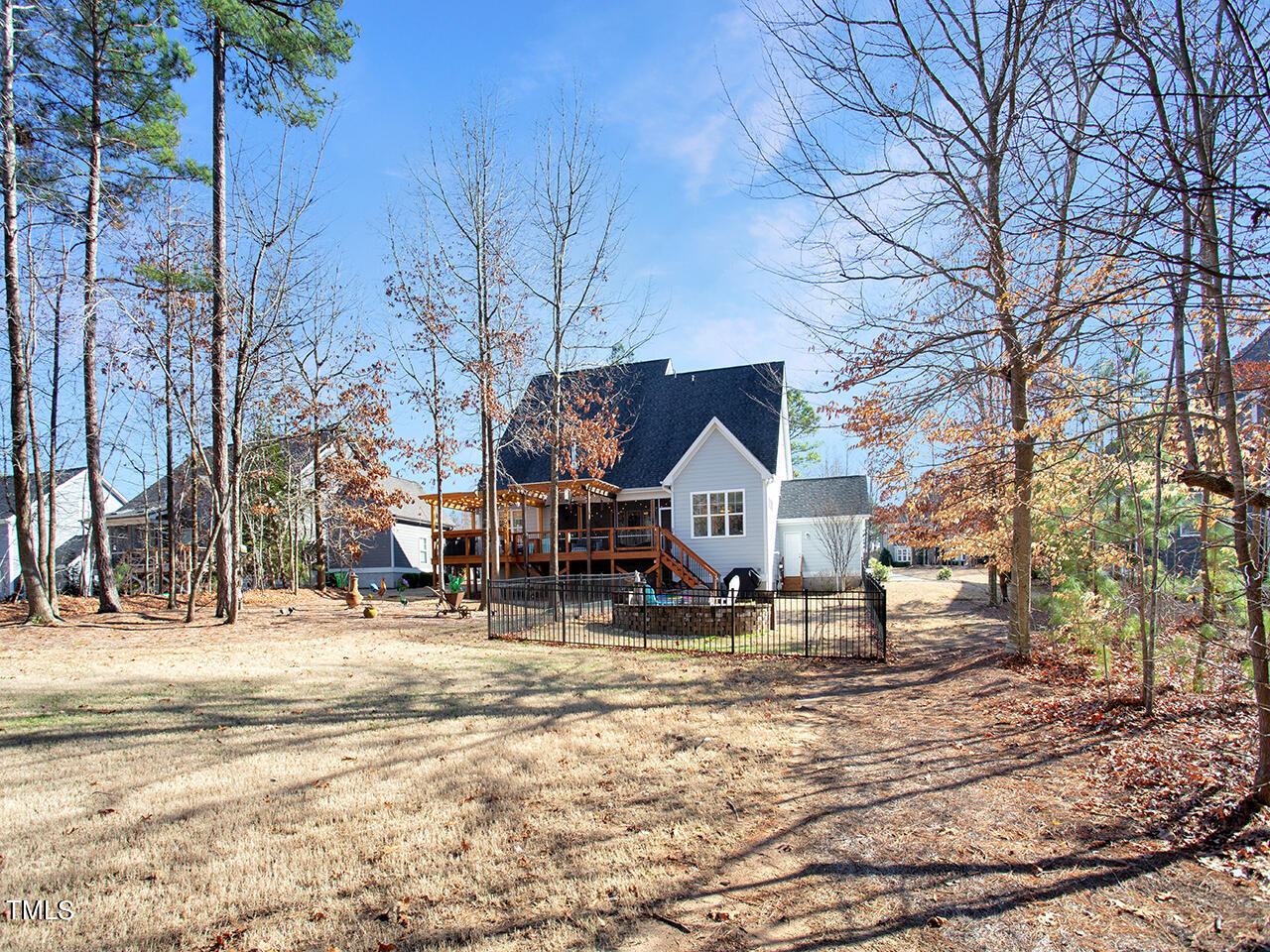 1109 Harrison Ridge Road Wake Forest, NC 27587 - Photo 59 of 86 a view of a house with a yard covered in snow
