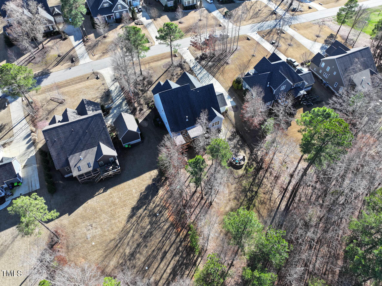 1109 Harrison Ridge Road Wake Forest, NC 27587 - Photo 68 of 86 an aerial view of a house with a yard