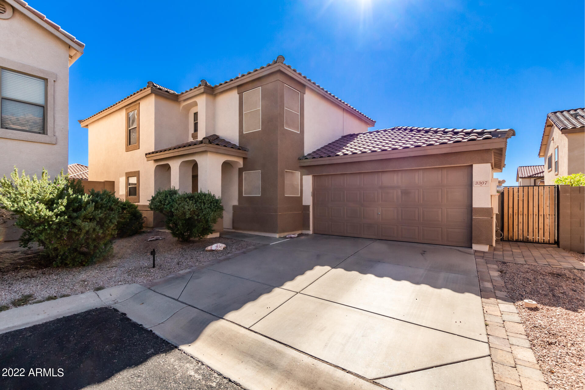 3307 South Bowman Road Apache Junction, AZ 85119 - Photo 1 of 28 a front view of a house with a garage