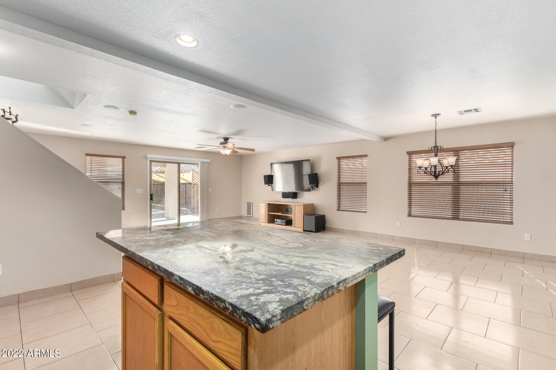 3307 South Bowman Road Apache Junction, AZ 85119 - Photo 12 of 28 a kitchen with kitchen island granite countertop a counter space and stainless steel appliances