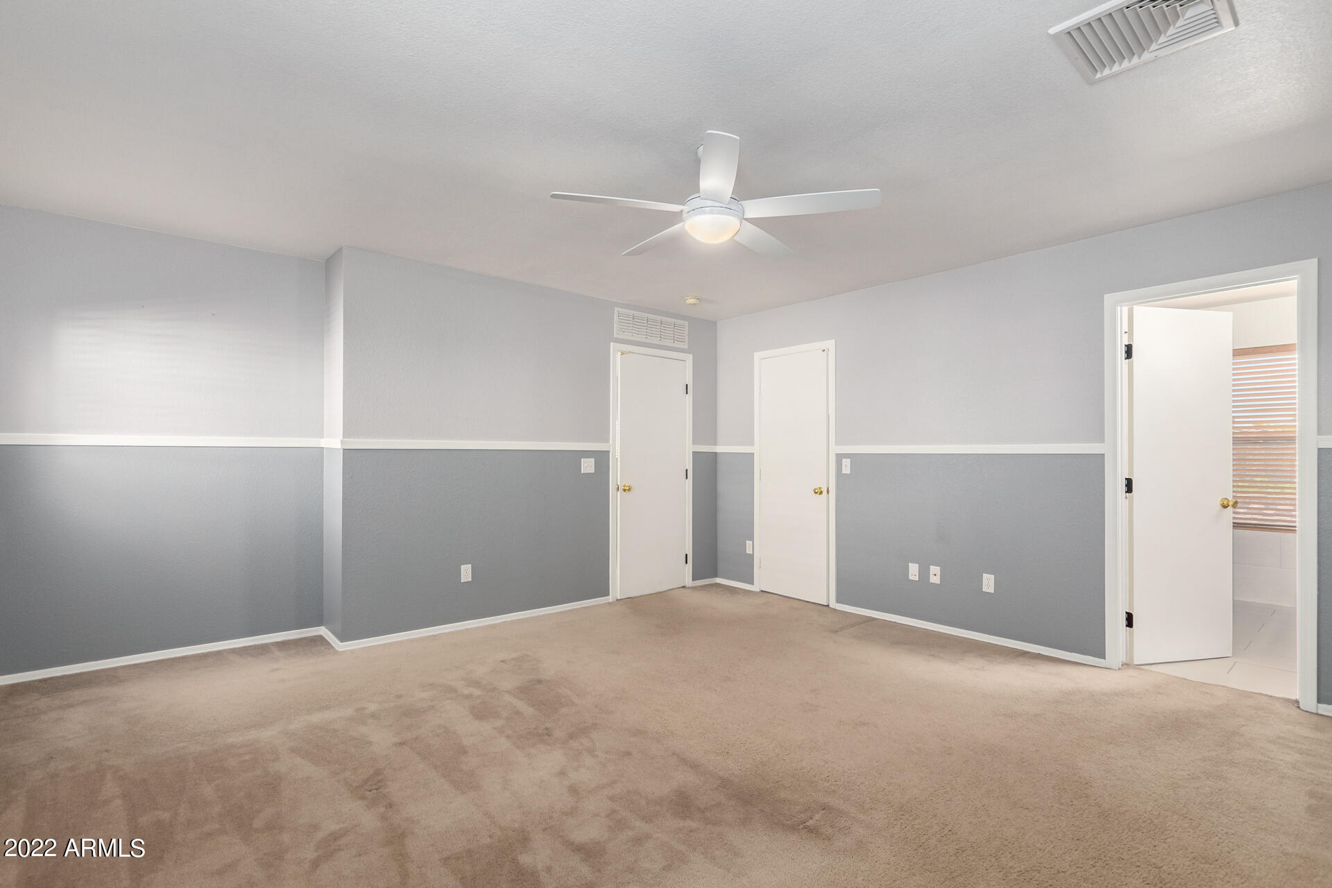 3307 South Bowman Road Apache Junction, AZ 85119 - Photo 14 of 28 a view of an empty room with a ceiling fan