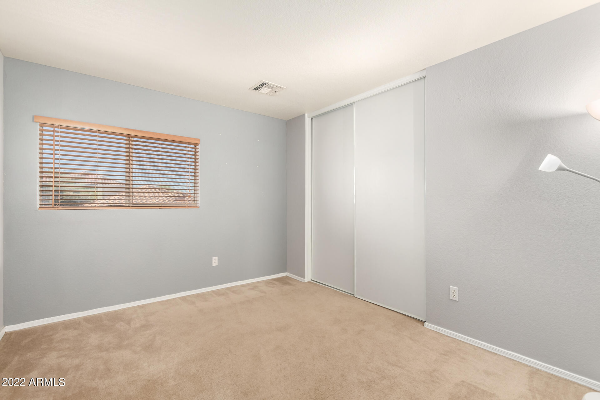 3307 South Bowman Road Apache Junction, AZ 85119 - Photo 17 of 28 a view of an empty room with a window