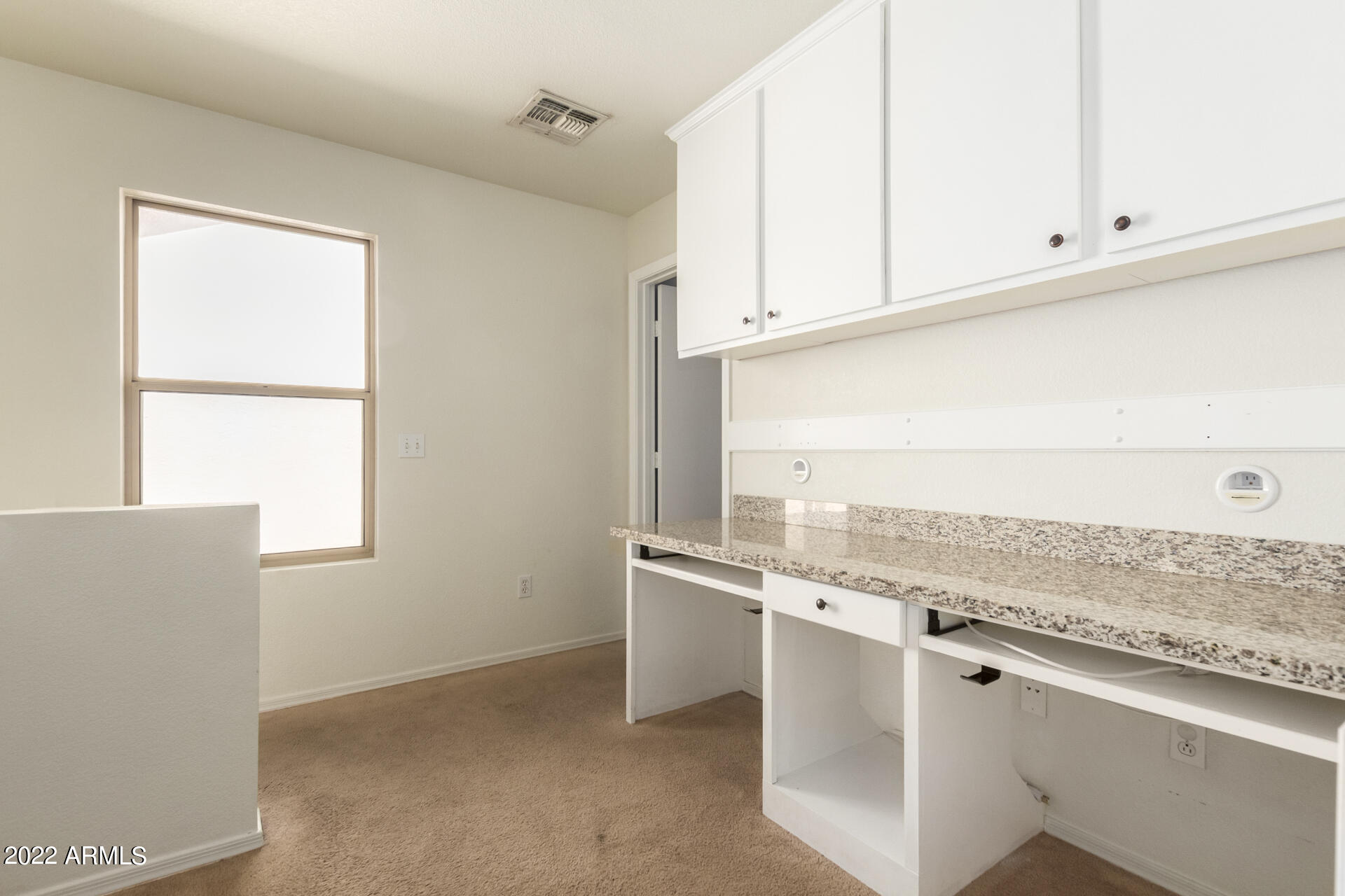 3307 South Bowman Road Apache Junction, AZ 85119 - Photo 23 of 28 a view of cabinets and window