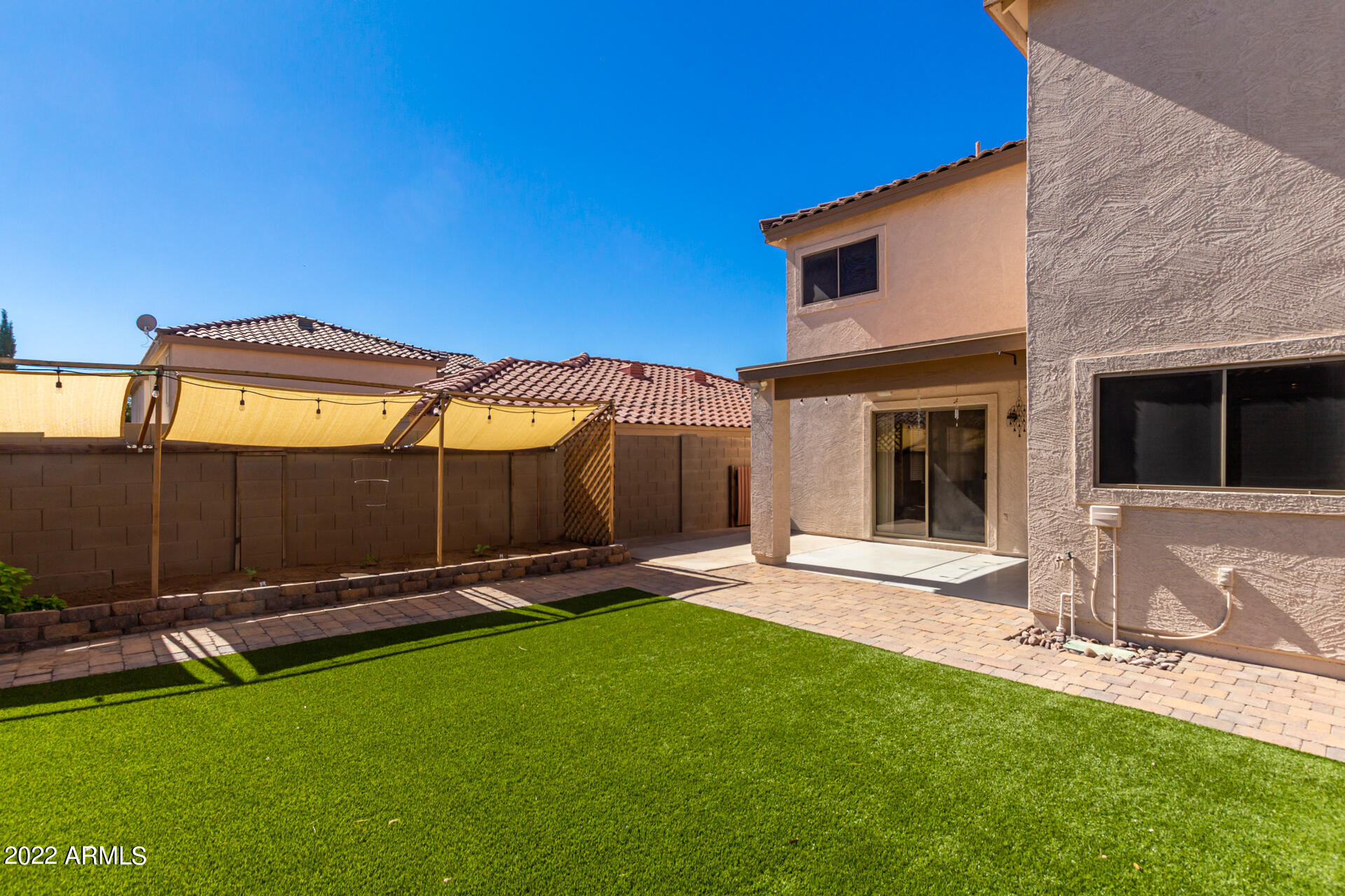3307 South Bowman Road Apache Junction, AZ 85119 - Photo 27 of 28 a backyard of a house with table and chairs
