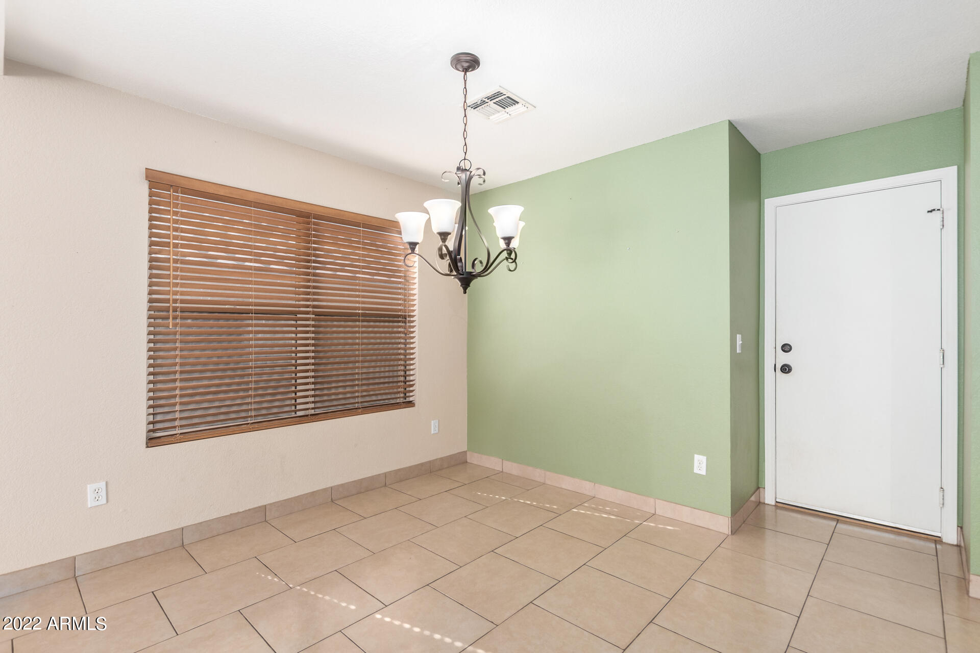 3307 South Bowman Road Apache Junction, AZ 85119 - Photo 5 of 28 a view of a room with windows and chandelier