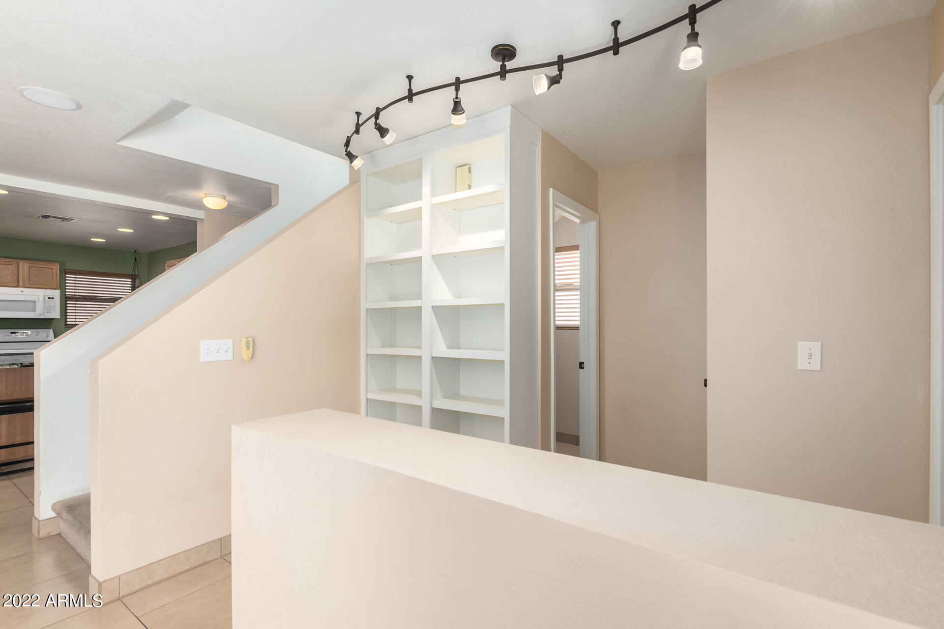 3307 South Bowman Road Apache Junction, AZ 85119 - Photo 6 of 28 a view of a hallway with wooden floor and entryway