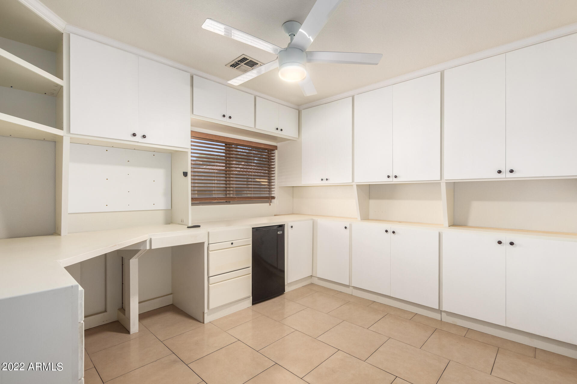 3307 South Bowman Road Apache Junction, AZ 85119 - Photo 8 of 28 a kitchen with cabinets and window