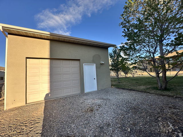 140 North 200 E Street Glenwood, UT 84730 - Photo 48 of 54 Garage featuring driveway