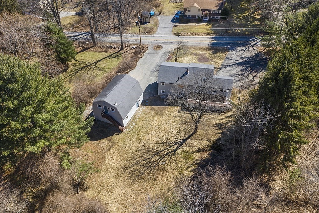 165 Hunt Road Chelmsford, MA 01824 - Photo 3 of 42 a view of a yard with trees