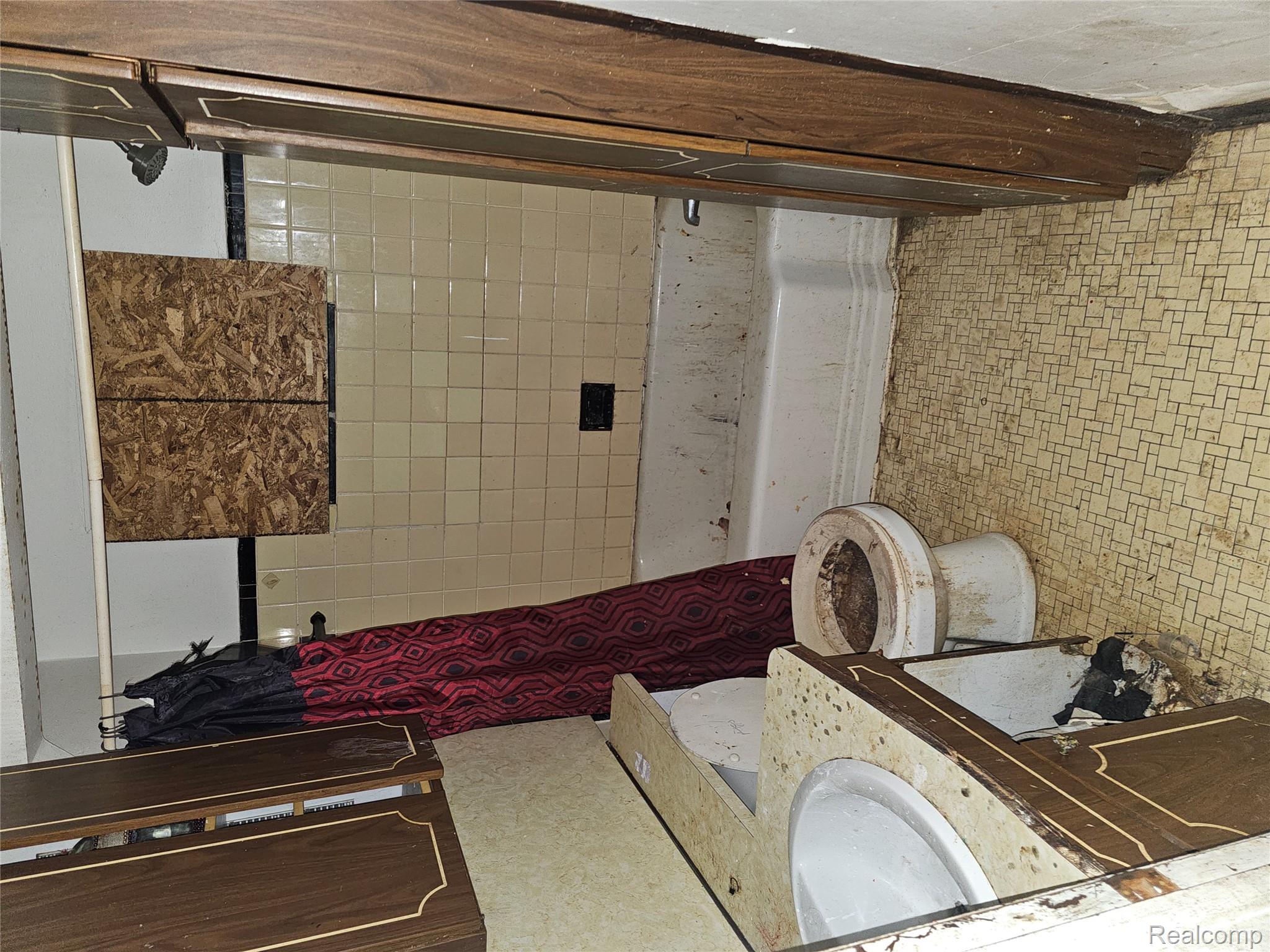 19442 Moross Road Detroit, MI 48224 - Photo 13 of 48 Bathroom featuring shower / tub combo with curtain, vanity, and light floors