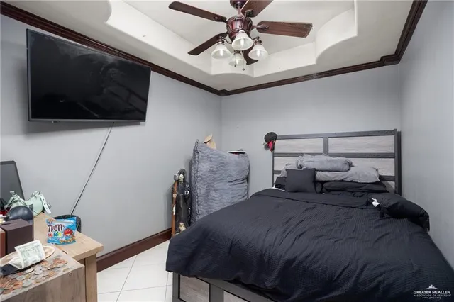 a bedroom with a bed and flat screen tv