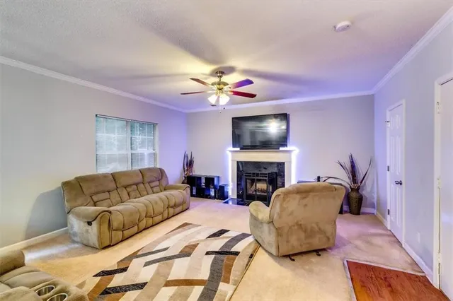 a bedroom with a bed couch and window