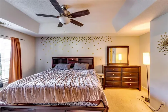 a bedroom with a large bed and a window