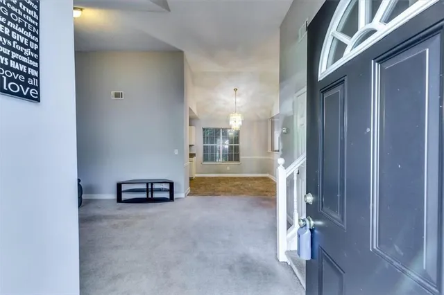 a living room with furniture a window and a wooden floor