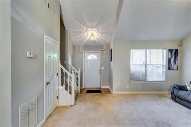 a view of livingroom with furniture and staircase