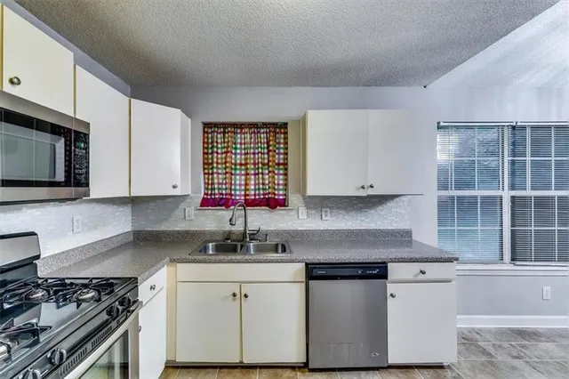 a living room with a couch and a large window
