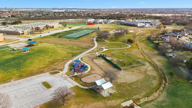 an aerial view of residential houses with outdoor space