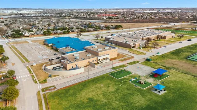 an aerial view of a house with outdoor space