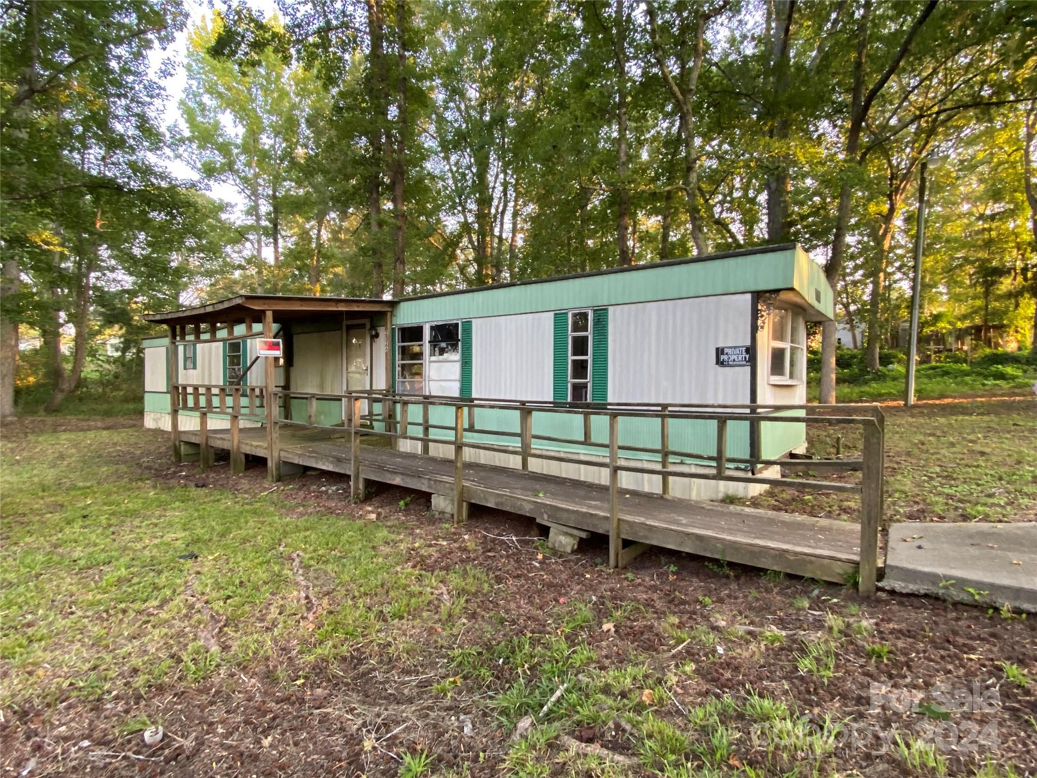 a backyard of a house with barbeque oven
