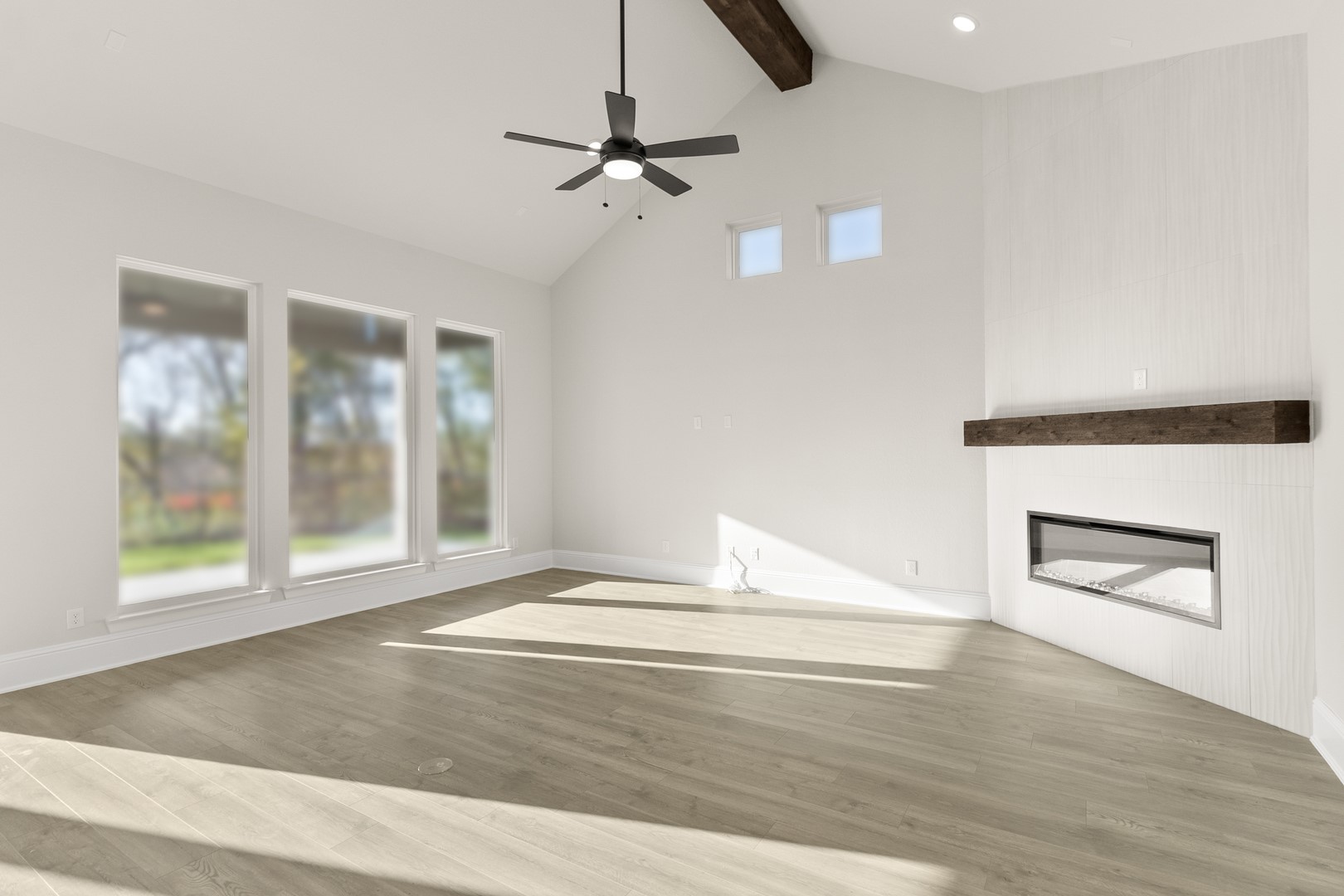 7914 Blue Dasher Pk Place Fulshear, TX 77441 - Photo 11 of 30 a view of an empty room with a window and wooden floor