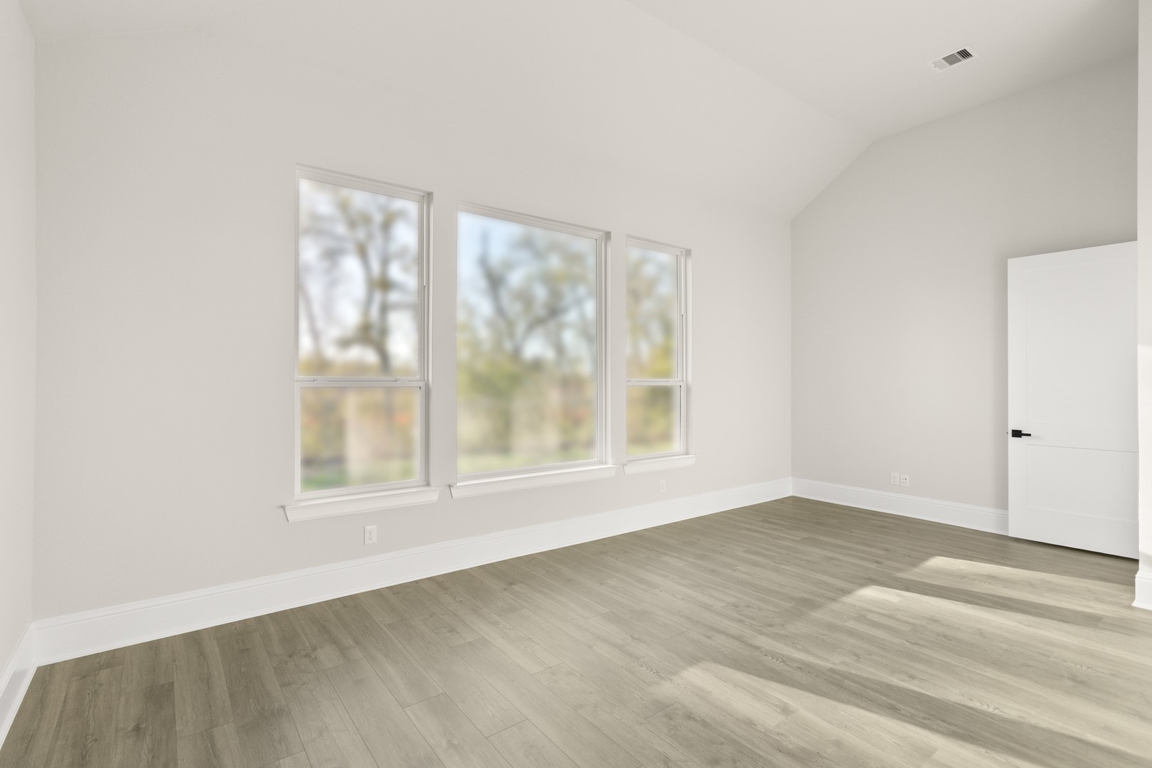 7914 Blue Dasher Pk Place Fulshear, TX 77441 - Photo 13 of 30 an empty room with wooden floor and windows