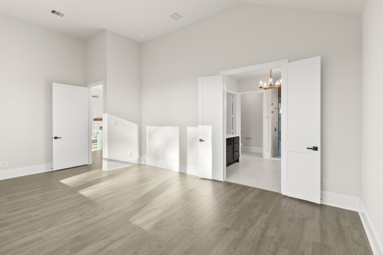 7914 Blue Dasher Pk Place Fulshear, TX 77441 - Photo 14 of 30 a view of a big room with wooden floor and windows