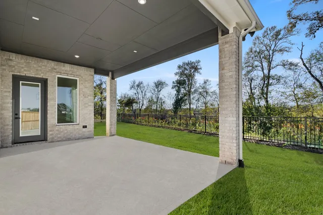 a view of a porch with a yard and garden