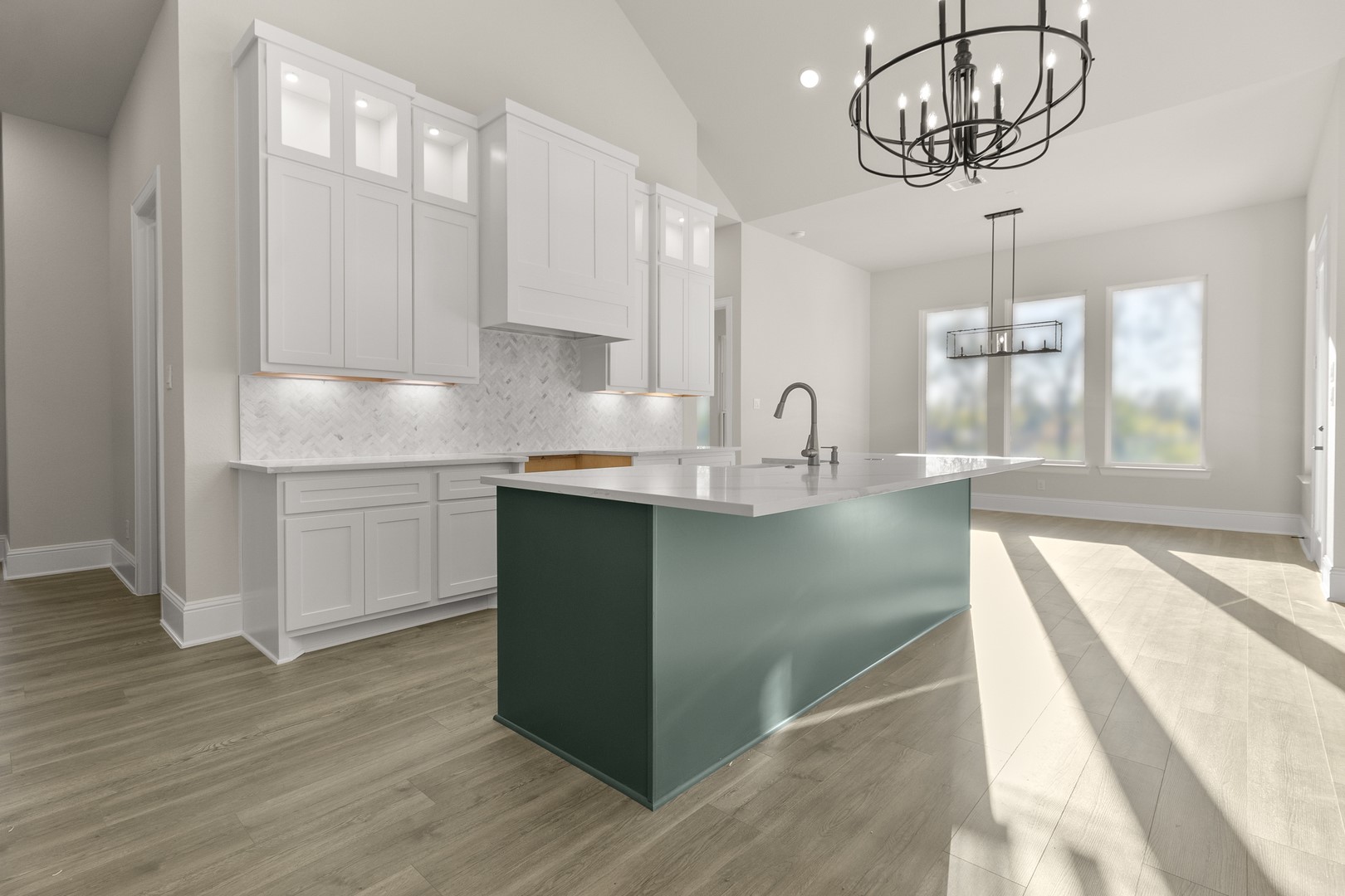 7914 Blue Dasher Pk Place Fulshear, TX 77441 - Photo 7 of 30 a kitchen with kitchen island granite countertop a sink cabinets and wooden floor